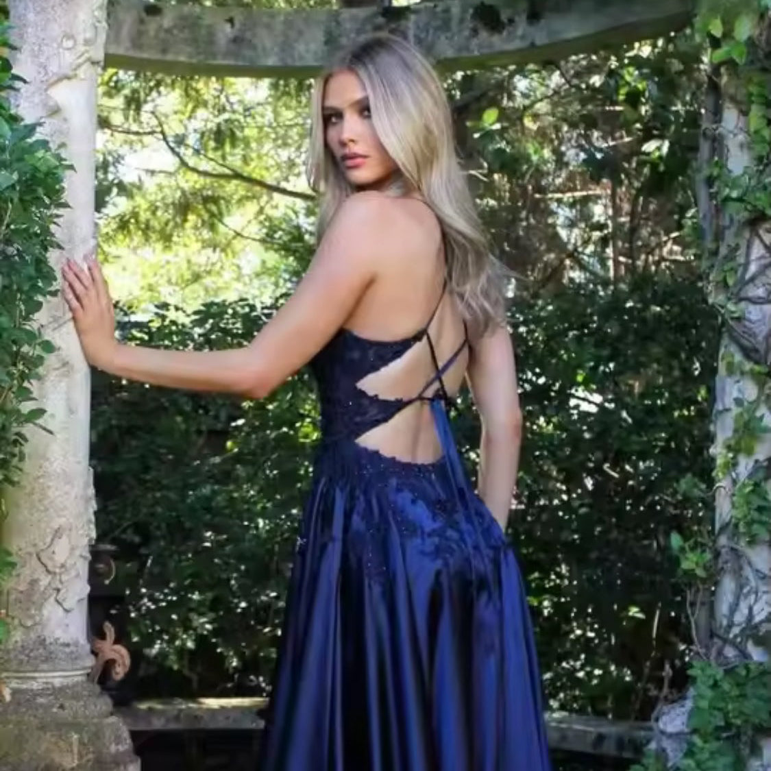 Dark navy blue satin A-line evening dress with spaghetti straps and lace-up back