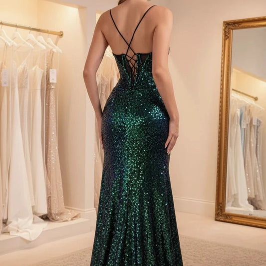 Green sequin mermaid dress with spaghetti straps and open back detail; long fitted hem.
