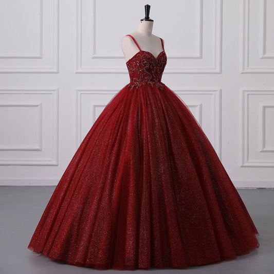 Red tulle ball gown with sparkling sequined bodice and full pleated skirt
