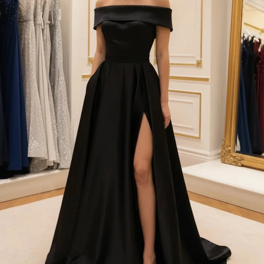 Green off-shoulder satin gown with fitted waist and flowing A-line skirt, side slit