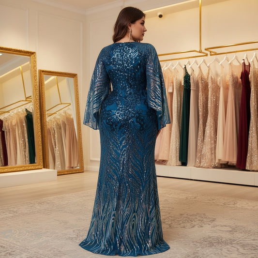 Blue sequin evening dress with long sleeves and floor-length back view, keyhole neckline