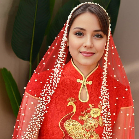 Red tulle bridal veil with pearl bead trim and scattered dot detailing