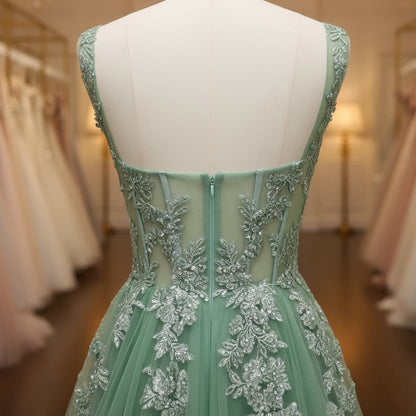 Green lace appliqué open-back tulle dress with corset-style back seams