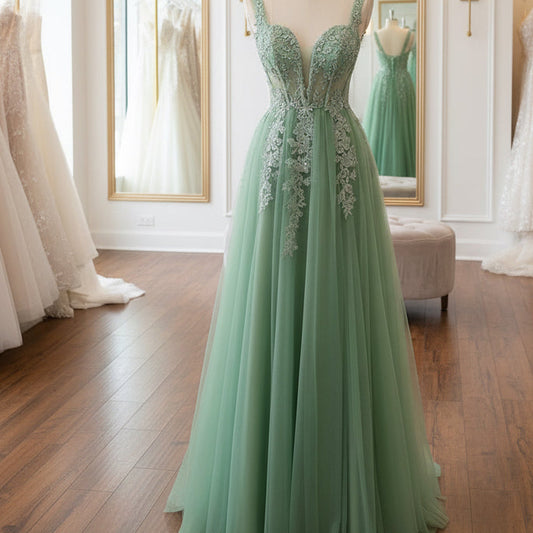Green A-line lace tulle dress with V-neck bodice and sheer lace shoulder straps