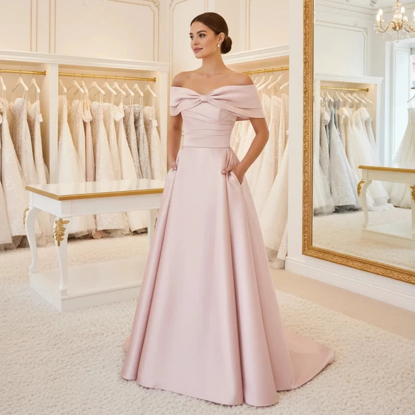 Off-shoulder satin A-line formal dress in pale pink, front bow detail