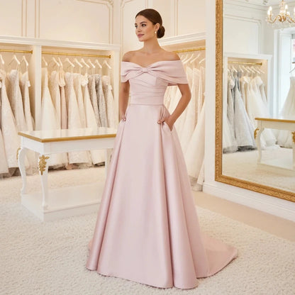 Off-shoulder satin A-line formal dress in pale pink, front bow detail
