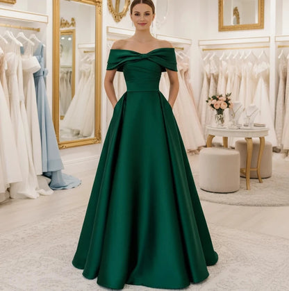 Off-shoulder satin A-line formal dress in dark green, front bow detail