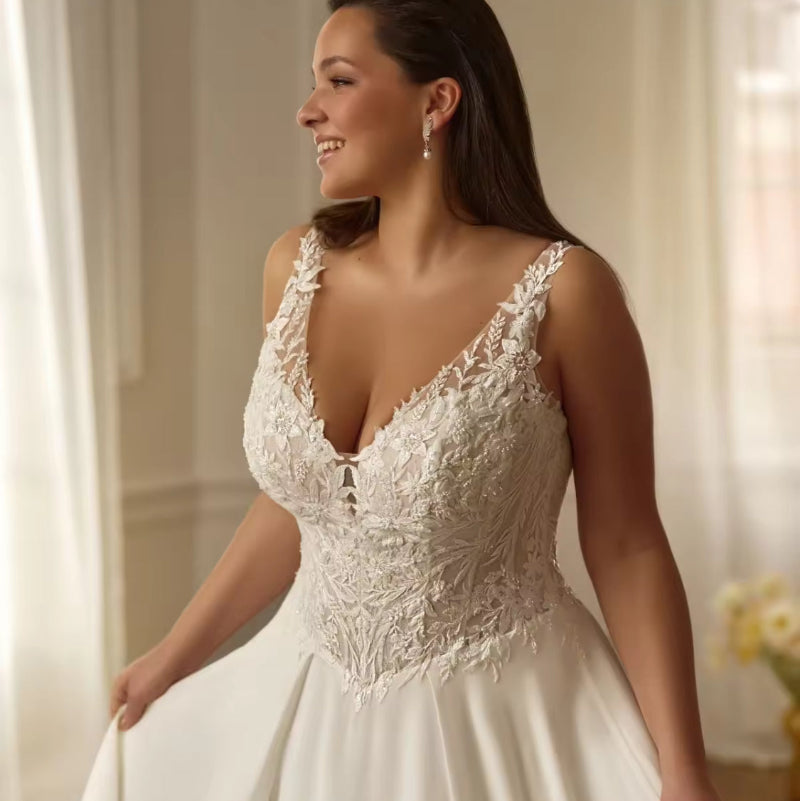 Ivory A-line wedding dress bodice with deep V-neck and ornate lace applique