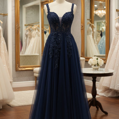Navy lace tulle A-line formal gown with beaded corset bodice and spaghetti straps