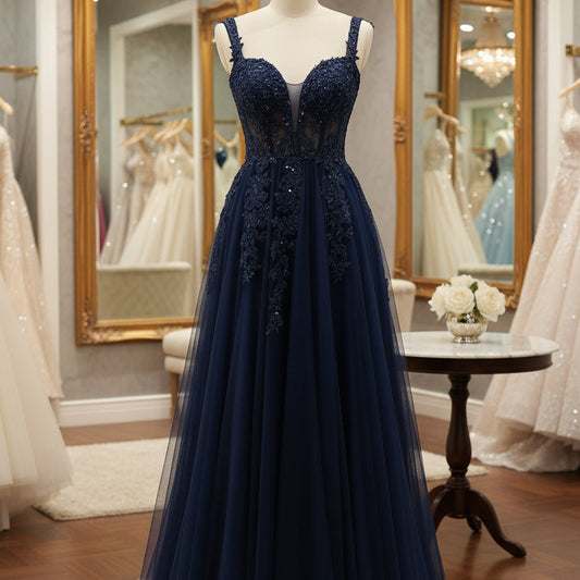 Navy lace tulle A-line formal gown with beaded corset bodice and spaghetti straps