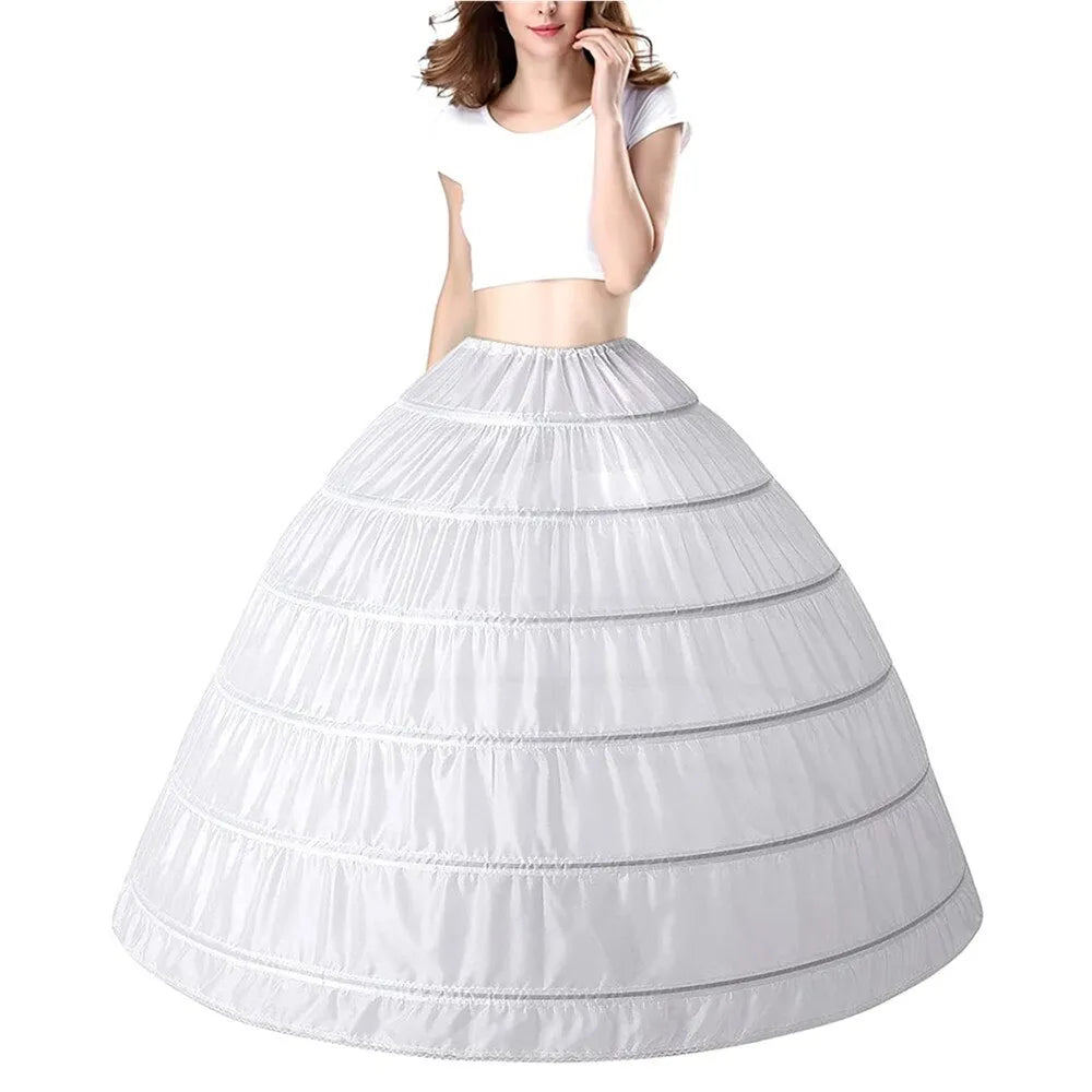 White crinoline petticoat worn under a wedding dress, forming a full ball-gown skirt
