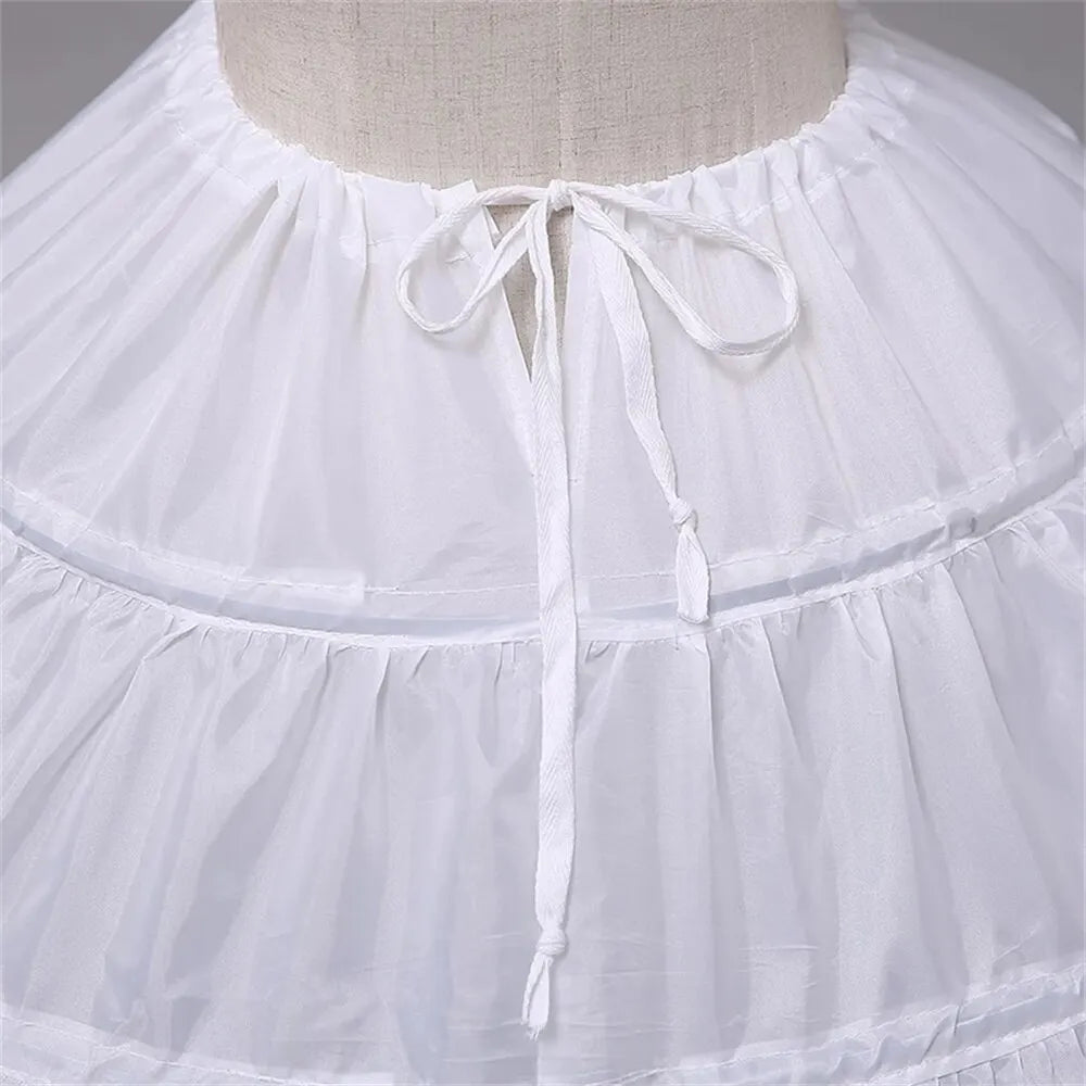 White crinoline petticoat neckline with gathered waistband and tied bow at center front