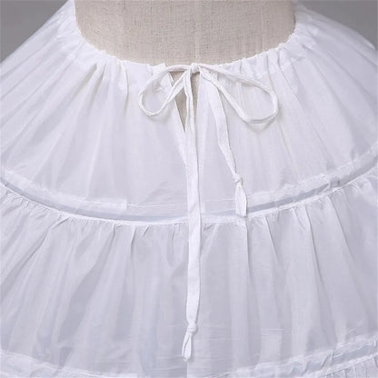 White crinoline petticoat neckline with gathered waistband and tied bow at center front