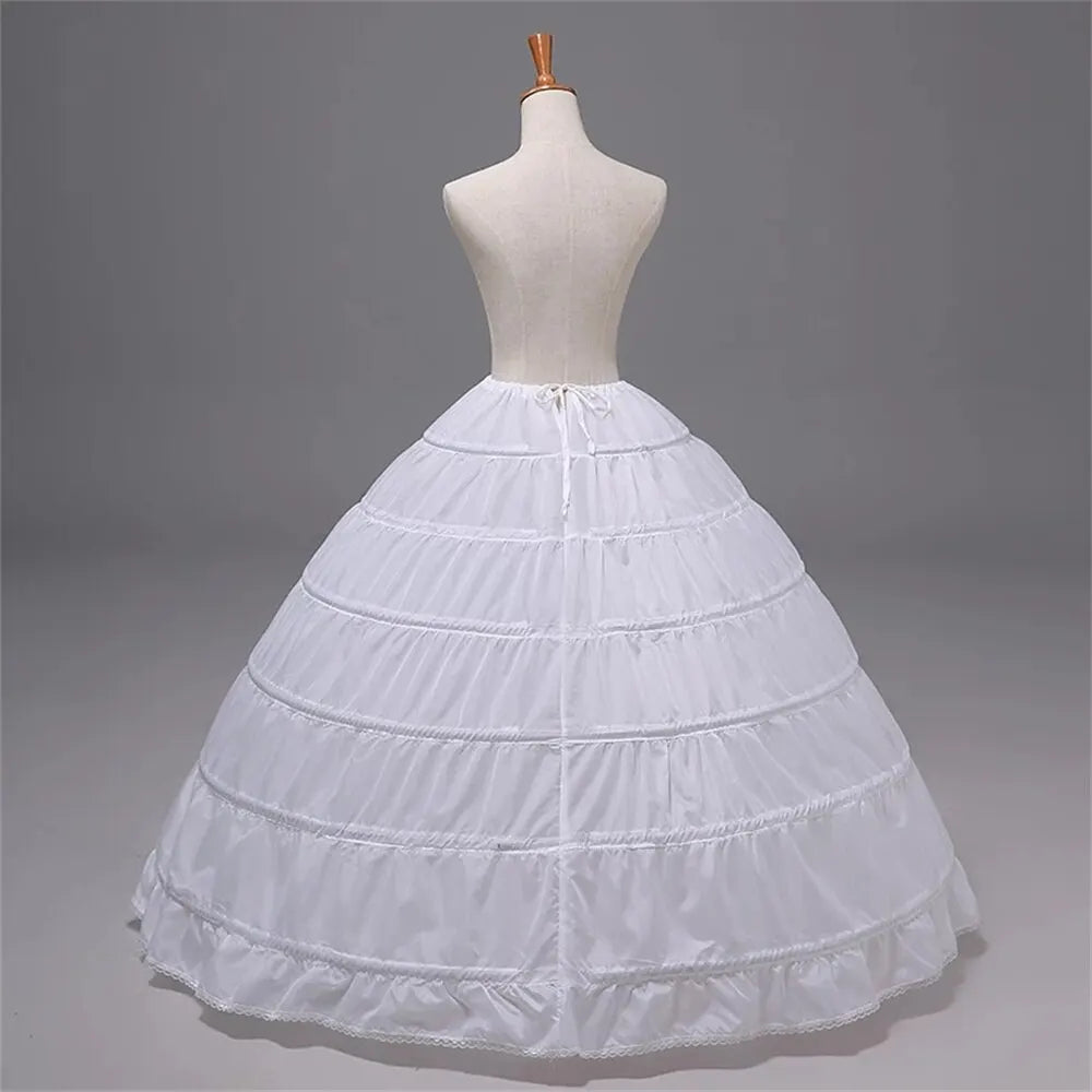 White 6-hoop crinoline petticoat with ruffled layers and front tie at waist