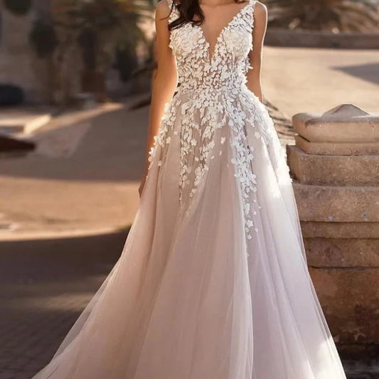 Ivory sleeveless tulle wedding dress with V-neck floral lace and flowing skirt