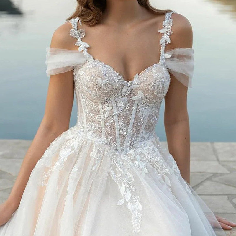 Ivory off-shoulder lace corset wedding dress bodice with floral appliques and sparkle