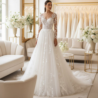White illusion lace wedding dress with long sleeves, floral embroidery, full gathered skirt