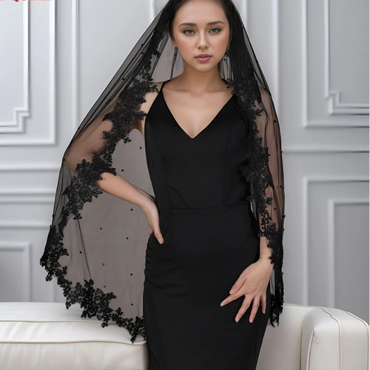 Black wedding veil with lace trim and sheer dotted tulle, draping to shoulders