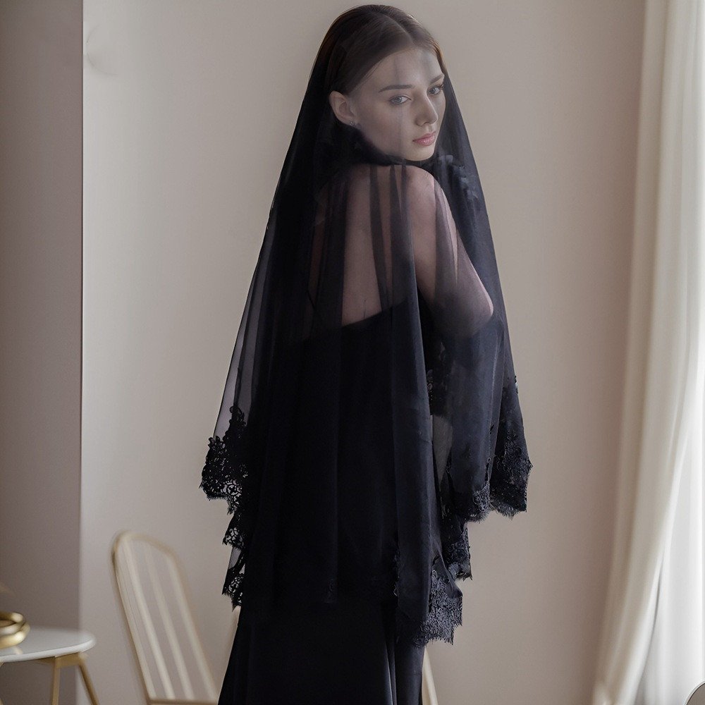 Black short veil draped over shoulders with lace scalloped hem