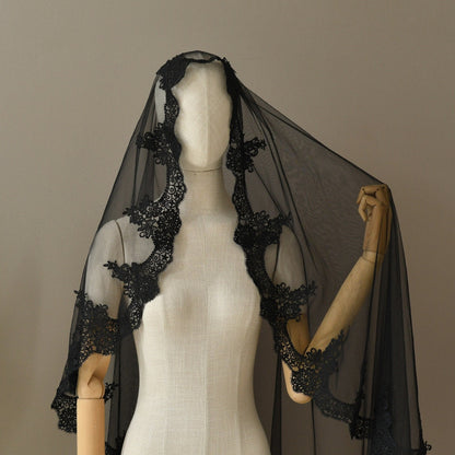 Black sheer veil with lace appliques and scalloped edge on mannequin
