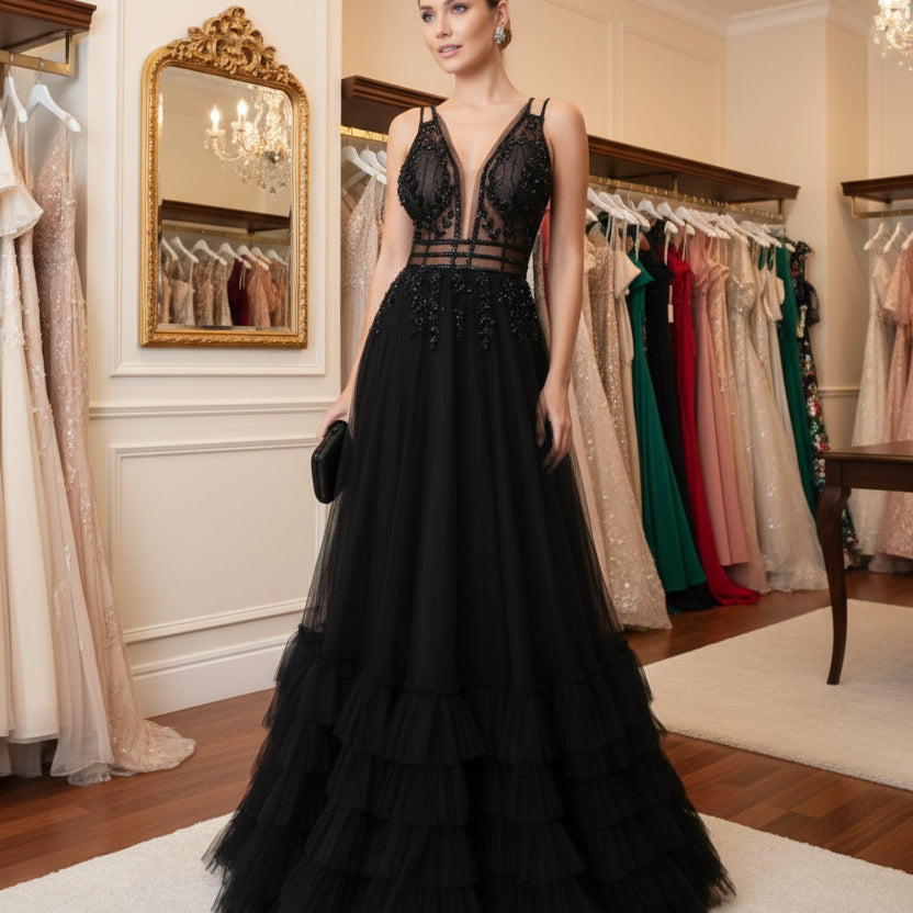 Black A-line evening dress with lace appliques, strappy sheer neckline, full tiered ruffles