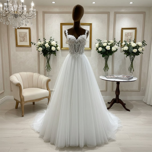 Ivory A-line wedding dress with lace illusion neckline and embroidered bodice, tulle skirt