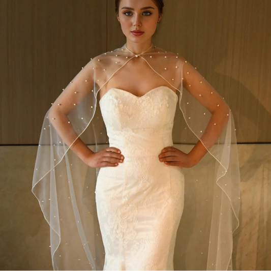 Bridal shawl cape with neck tie and pearl bead trim over shoulders