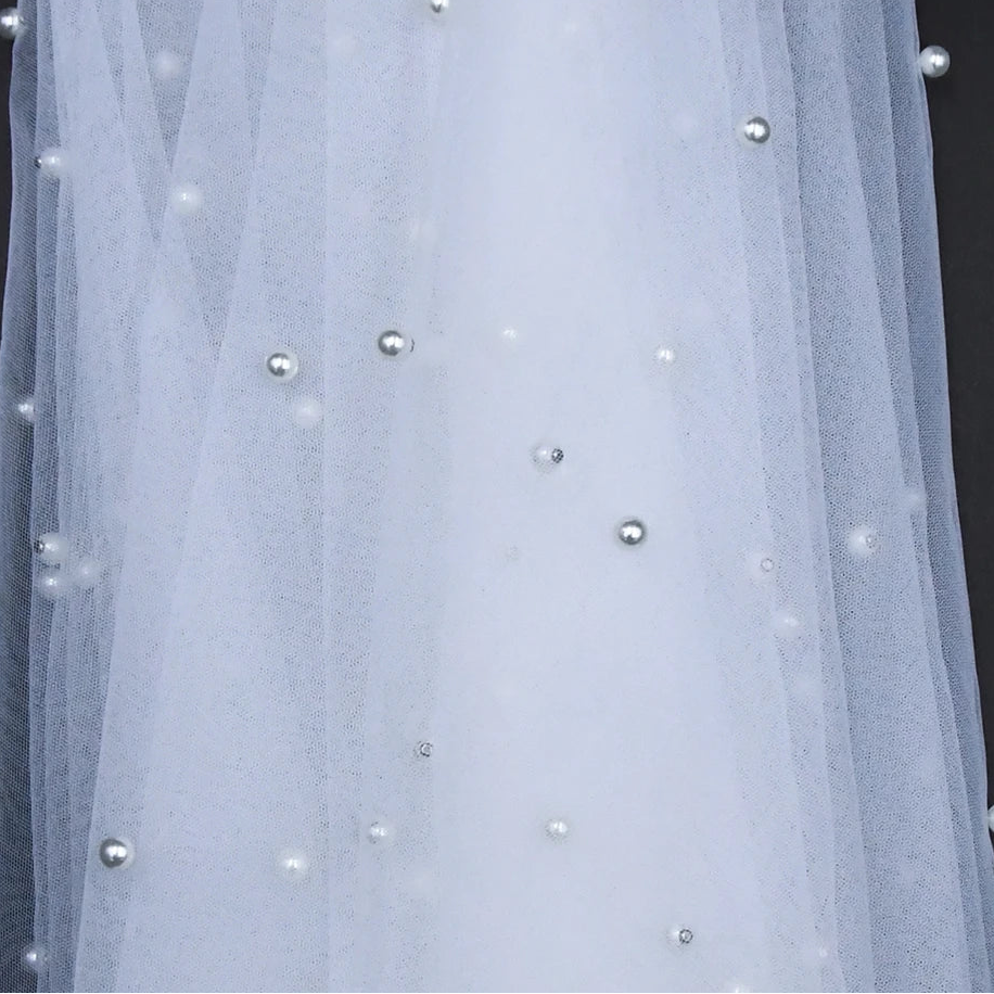 Sheer voile bridal shawl with scattered pearl beads on the mesh