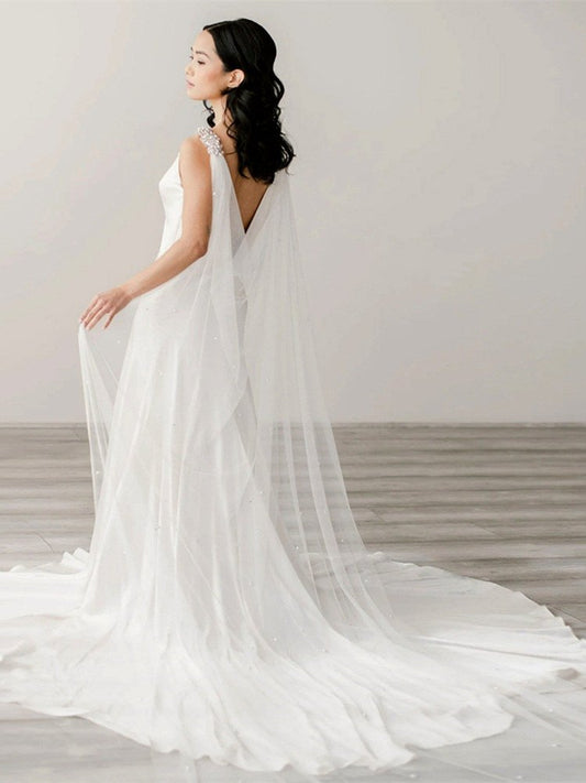 Bridal shoulder cape veil in white tulle with crystal and pearl trim at neckline