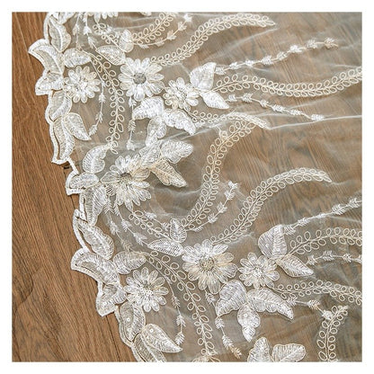 Ivory lace floral embroidery on sheer tulle veil, with scalloped edge detail