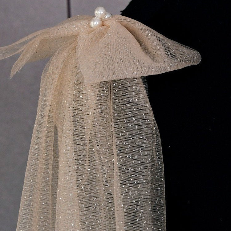 Champagne glitter tulle shoulder bow with pearl cluster and layered hanging fabric
