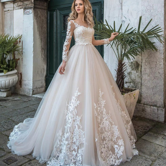White illusion lace tulle wedding dress with long sleeves and floral lace bodice, full skirt