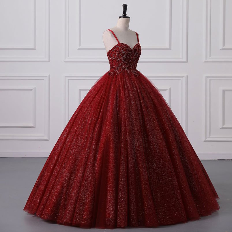 Red tulle ball gown with sparkling sequined bodice and full pleated skirt