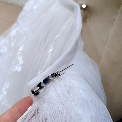 Ivory detachable train fastener snaps, sheer tulle with lace trim