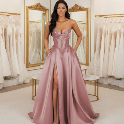 Dusty rose strapless A-line satin dress with sequin bust and thigh-high slit