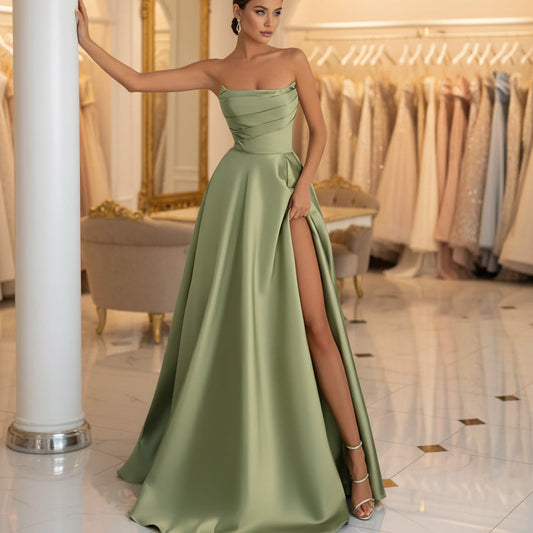 Green strapless satin A-line dress with ruched bodice and side slit