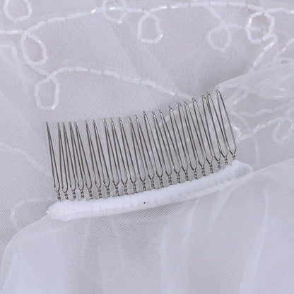 White tulle blusher veil comb with metal teeth and embroidered trim