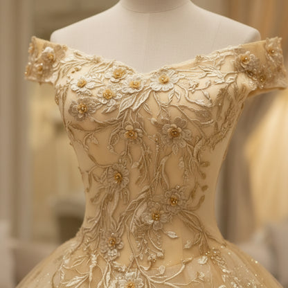 Gold glitter appliqué off-shoulder bodice with floral beading detail on mannequin