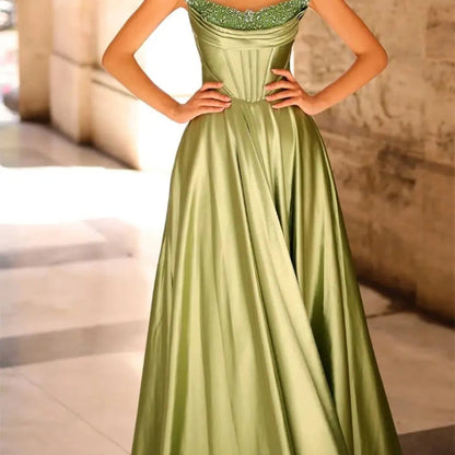 Green strapless satin A-line evening gown with beaded neckline and pleated skirt