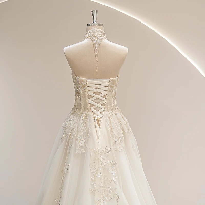 Ivory vintage wedding gown with crisscross corset back detail and ornate beading
