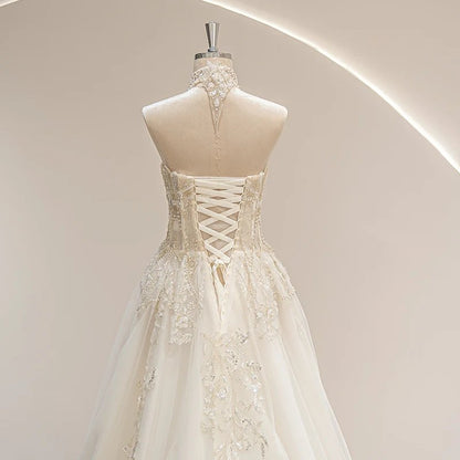 Ivory vintage wedding gown with crisscross corset back detail and ornate beading