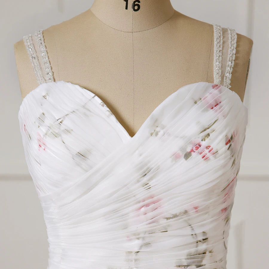 Sweetheart corset bodice of floral organza wedding dress with beaded trim on straps