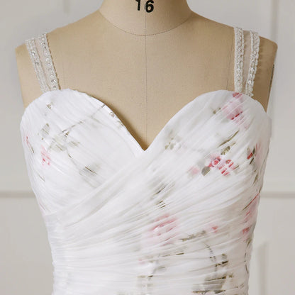 Sweetheart corset bodice of floral organza wedding dress with beaded trim on straps