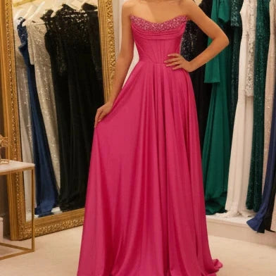 Fuchsia strapless beaded satin A-line evening gown with sparkling neckline
