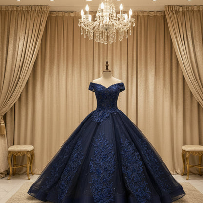 Off-shoulder navy evening gown with glitter appliques