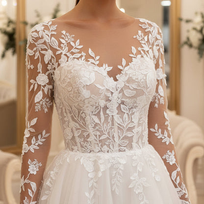 White illusion lace wedding dress with floral sleeves and embroidered bodice, full skirt