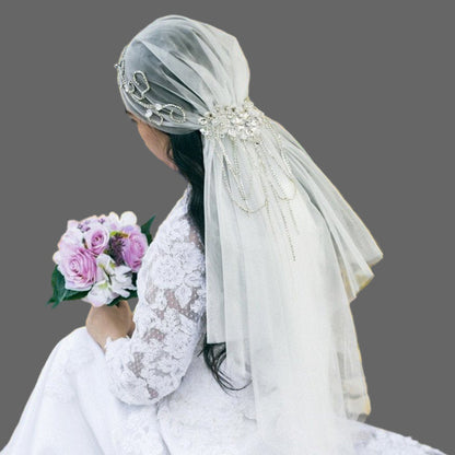 Ivory bridal veil with crystal-embellished cap and draping tulle, side rear view
