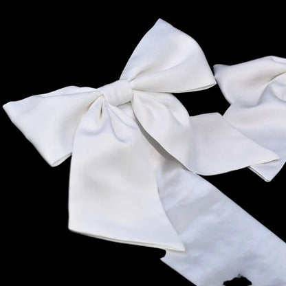 Ivory satin long glove with oversized bow and flowing ribbon cuff
