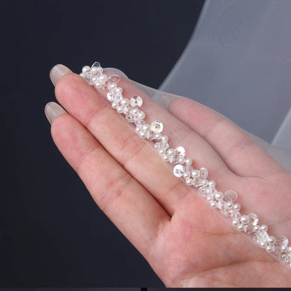 Ivory beaded-edge veil trim on mesh, pearls and beadwork along the border