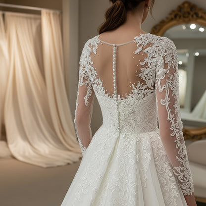 White lace wedding dress back with illusion panels, pearl straps, and floral embroidery
